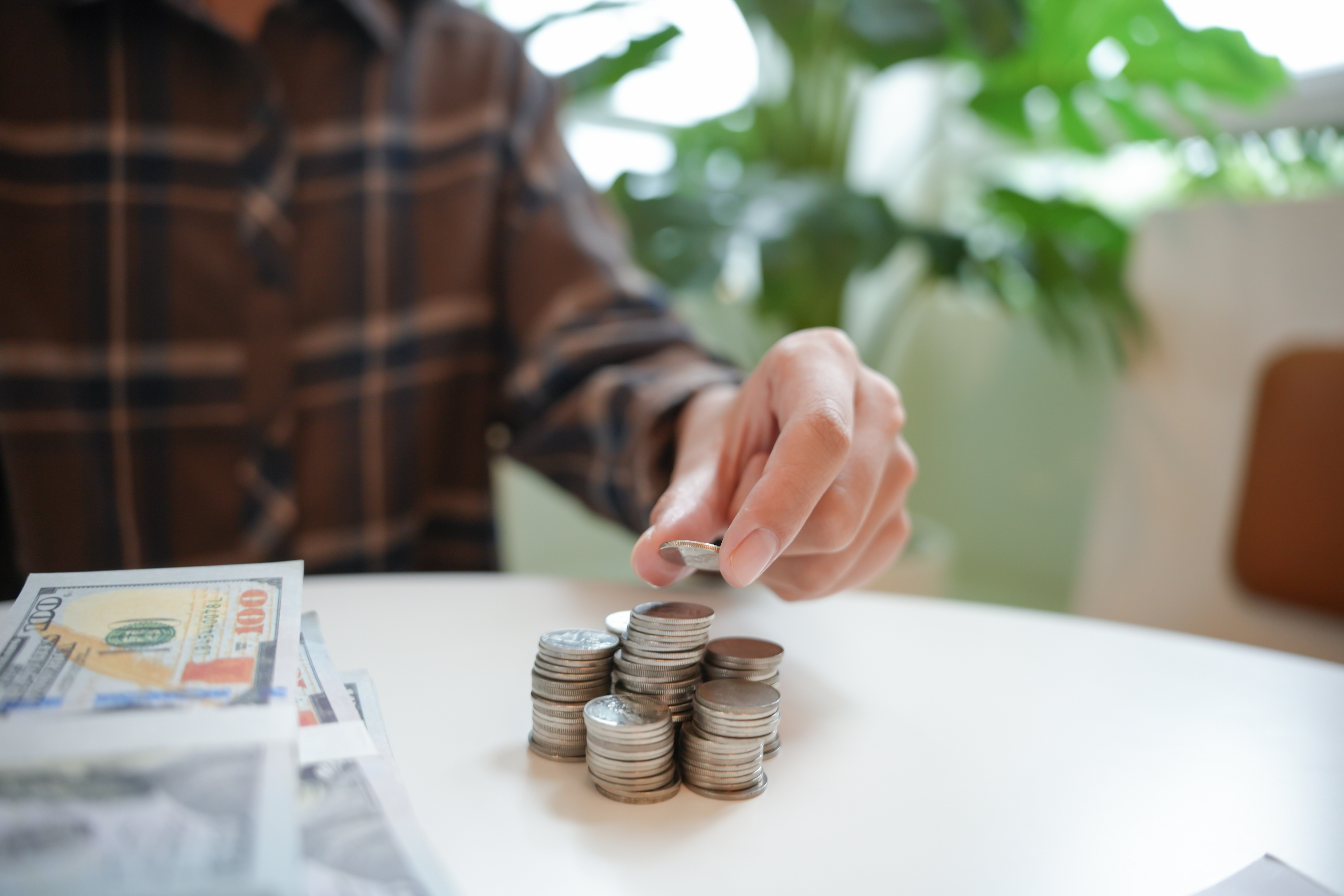 Female hand stack coins growing business. Saving money financial or loan for prepare in future financial insurance concept.