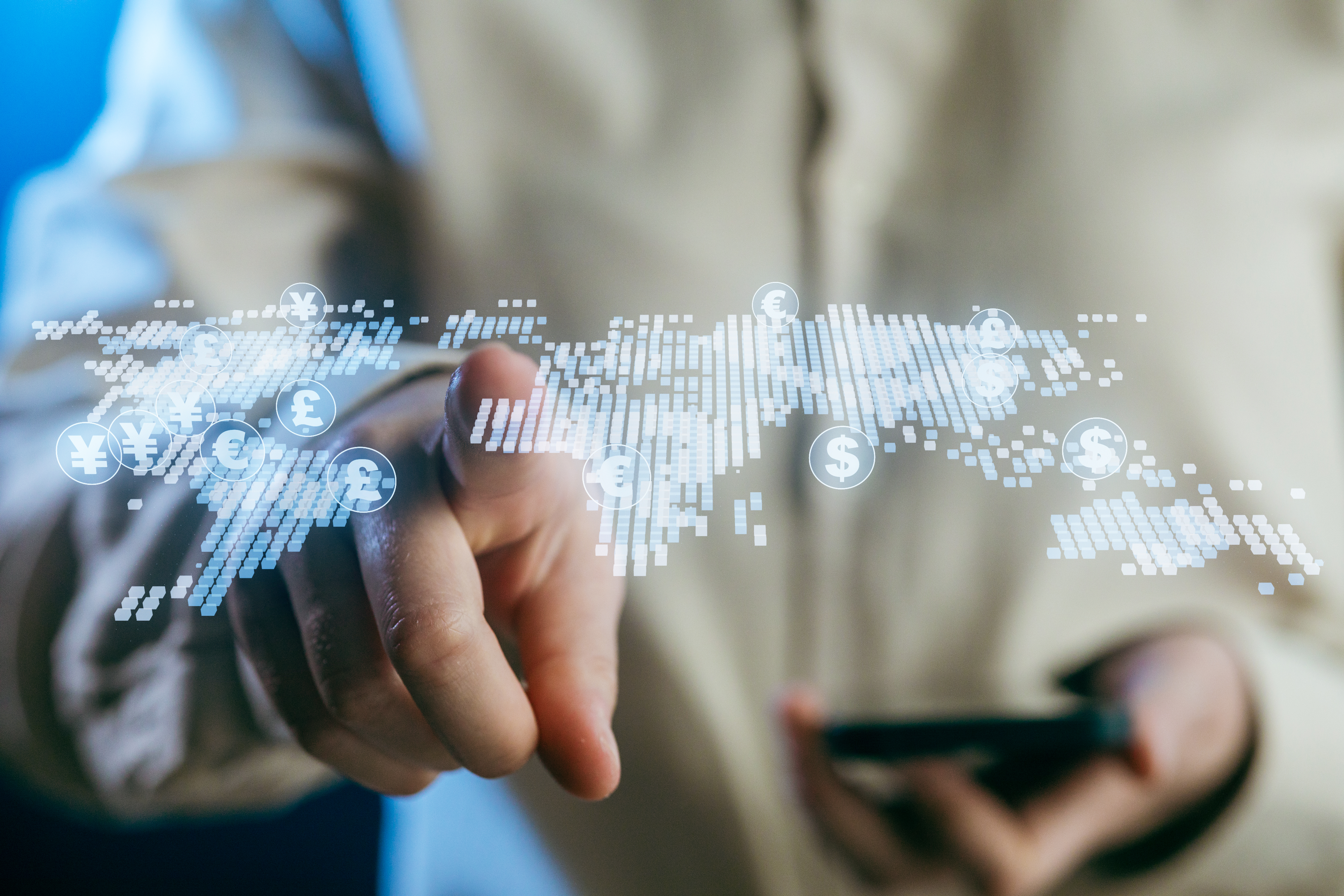 A person interacts with a digital display of global currency symbols, emphasizing the rise of financial technology. The scene highlights modern advancements in digital currencies.